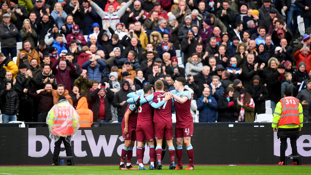 West Ham United's Michail Antonio celebrates scoring his side's third goal of the game with his team mates infront of the home fans during the Premier League match at London Stadium.