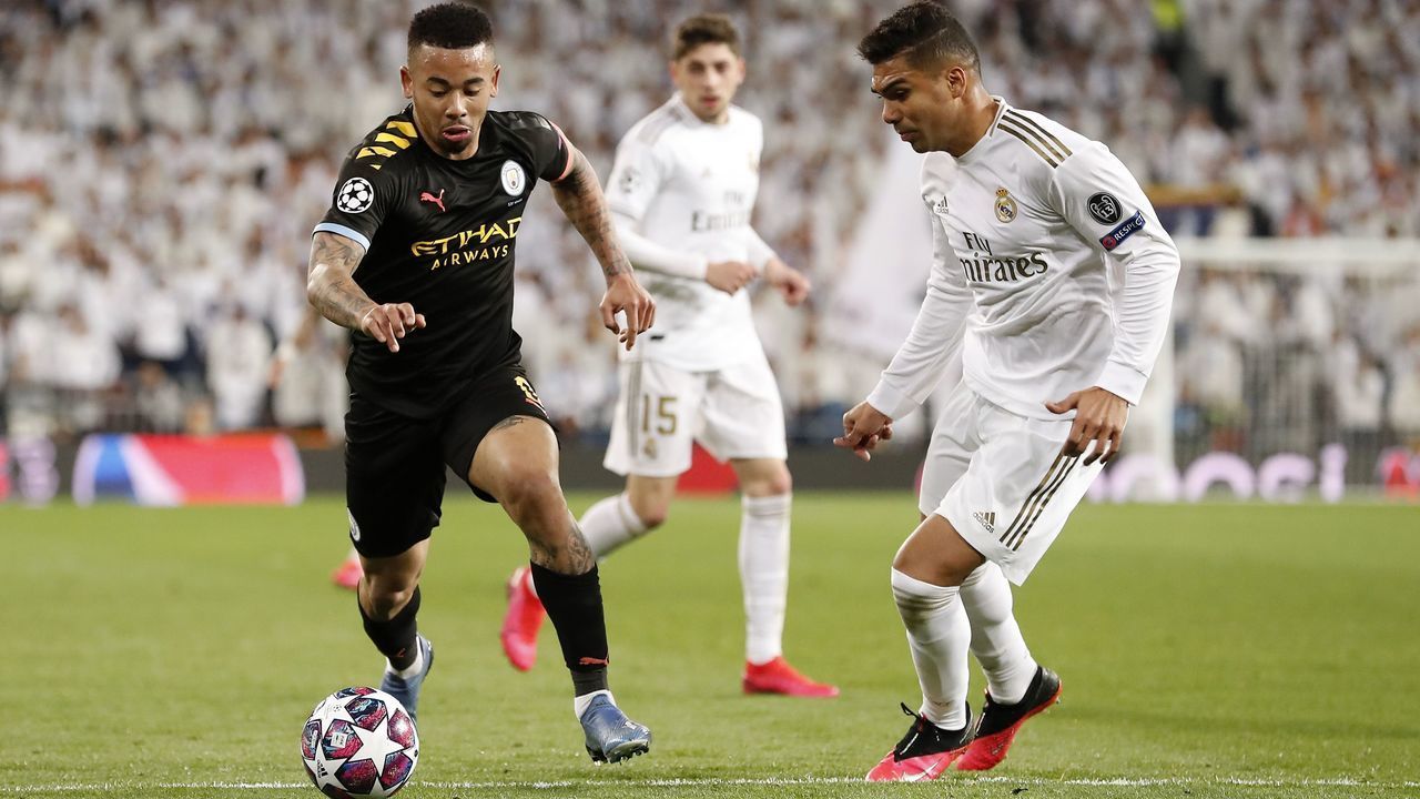 (L-R) Gabriel Jesus of Manchester City, Casemiro of Real Madrid during the UEFA Champions League round of 16 first leg match between Real Madrid and Manchester City FC at the Santiago Bernabeu stadium on February 26, 2020 in Madrid, Spain