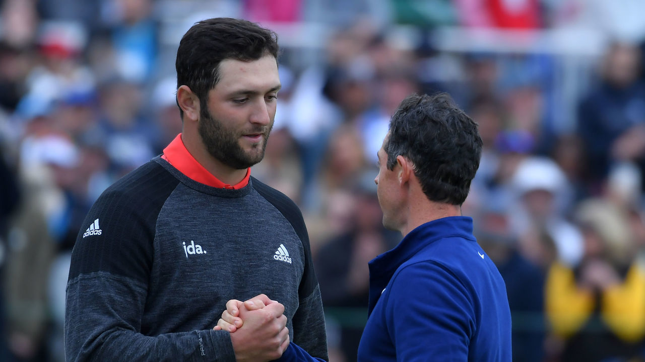 SAN DIEGO, CALIFORNIA - JANUARY 26: Jon Rahm of Spain shakes hands with Rory McIlroy of Northern Ireland on the 18th green during the final round of the Farmers Insurance Open at Torrey Pines South on January 26, 2020 in San Diego, California.
