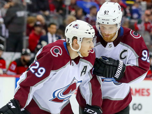 NEWARK, NJ - JANUARY 04: Colorado Avalanche left wing Gabriel Landeskog (92) talks with Colorado Avalanche center Nathan MacKinnon (29) during the National Hockey League game between the New Jersey Devils and the Colorado Avalanche on January 4, 2020 at the Prudential Center in Newark, NJ.