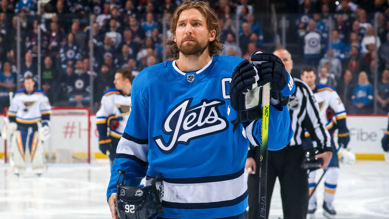 WINNIPEG, MB - FEBRUARY 1: Blake Wheeler #26 of the Winnipeg Jets stands on the ice during the singing of the National anthems prior to puck drop against the St. Louis Blues at the Bell MTS Place on February 1, 2020 in Winnipeg, Manitoba, Canada.