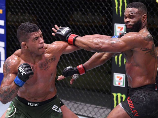 LAS VEGAS, NEVADA - MAY 30: (L-R) Gilbert Burns of Brazil punches Tyron Woodley in their welterweight fight during the UFC Fight Night event at UFC APEX on May 30, 2020 in Las Vegas, Nevada.