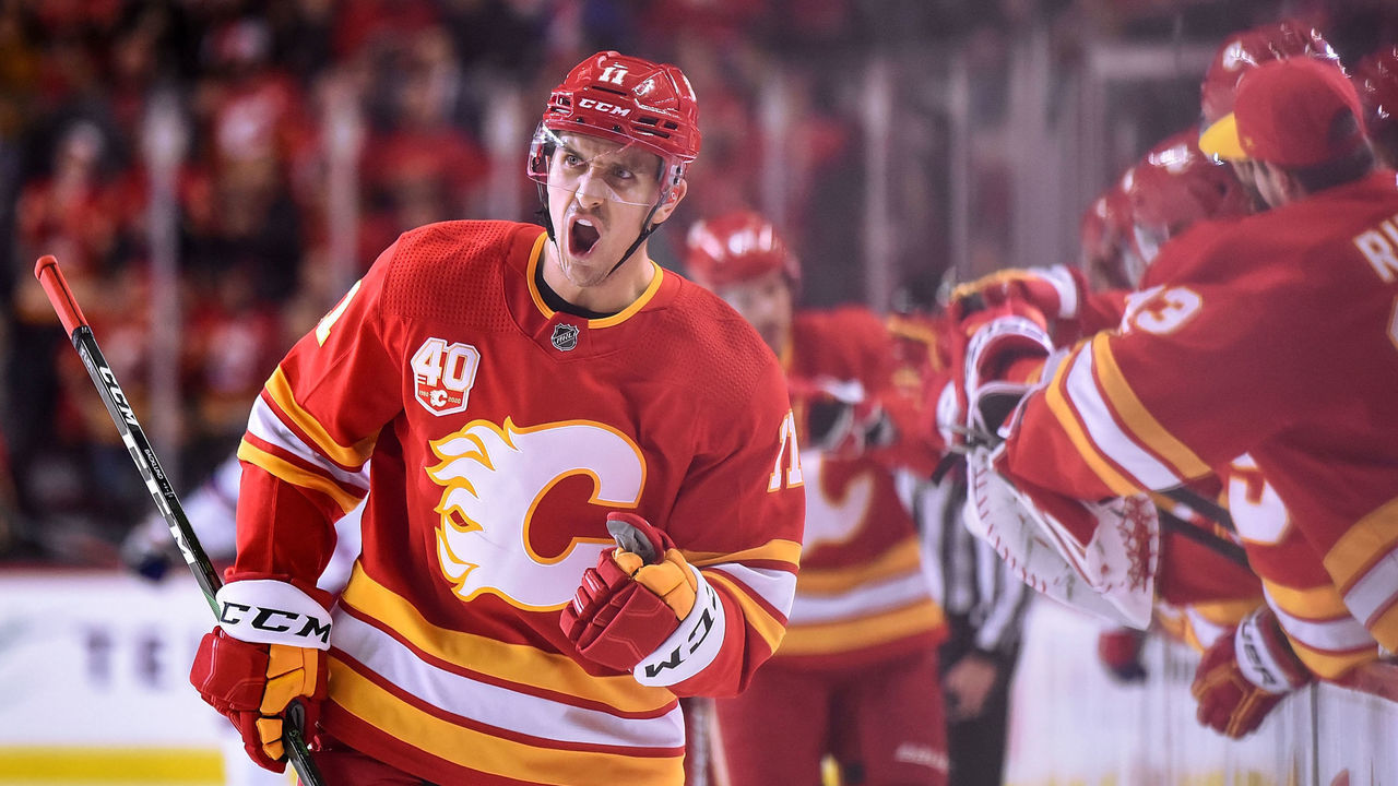 CALGARY, AB - JANUARY 02: Calgary Flames Right Wing Mikael Backlund (11) celebrates a goal against the New York Rangers with teammates during the first period of an NHL game where the Calgary Flames hosted the New York Rangers on January 2, 2020, at the Scotiabank Saddledome in Calgary, AB.