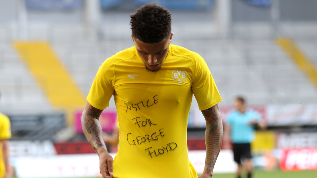 PADERBORN, GERMANY - MAY 31: Jadon Sancho of Borussia Dortmund celebrates scoring his teams second goal of the game with a 'Justice for George Floyd' shirt during the Bundesliga match between SC Paderborn 07 and Borussia Dortmund at Benteler Arena on May 31, 2020 in Paderborn, Germany.