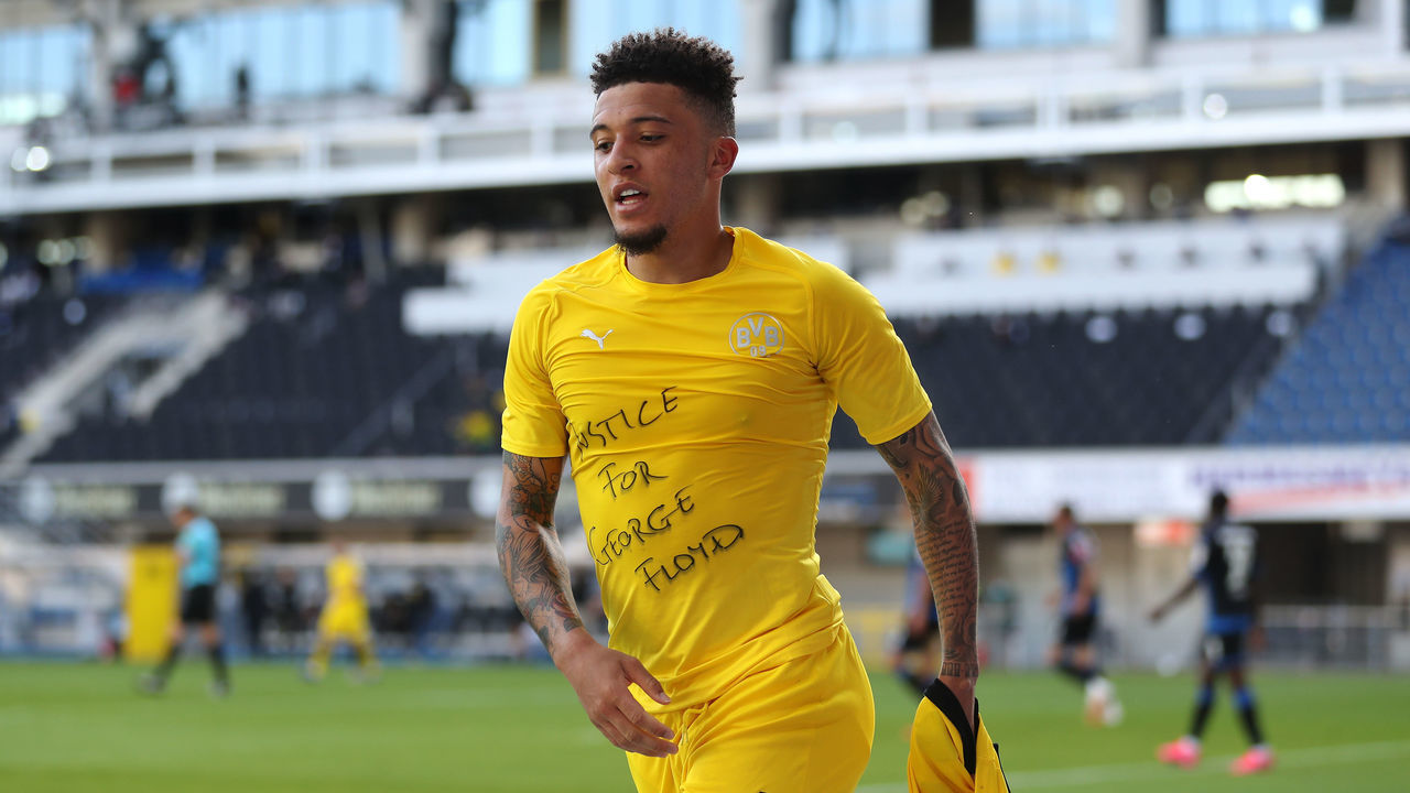 PADERBORN, GERMANY - MAY 31: Jadon Sancho of Borussia Dortmund celebrates scoring his teams second goal of the game with a 'Justice for George Floyd' shirt during the Bundesliga match between SC Paderborn 07 and Borussia Dortmund at Benteler Arena on May 31, 2020 in Paderborn, Germany.