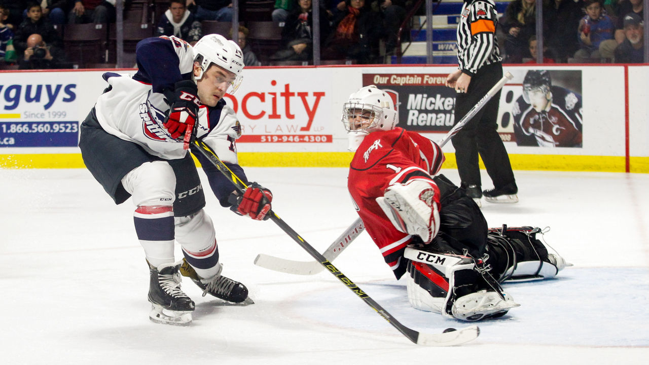WINDSOR, ON - NOVEMBER 16: Defenceman Sean Day #74 of the Windsor Spitfires scores his second-period goal past goaltender Mack Guzda #1 of the Owen Sound Attack on November 16, 2017 at the WFCU Centre in Windsor, Ontario, Canada.