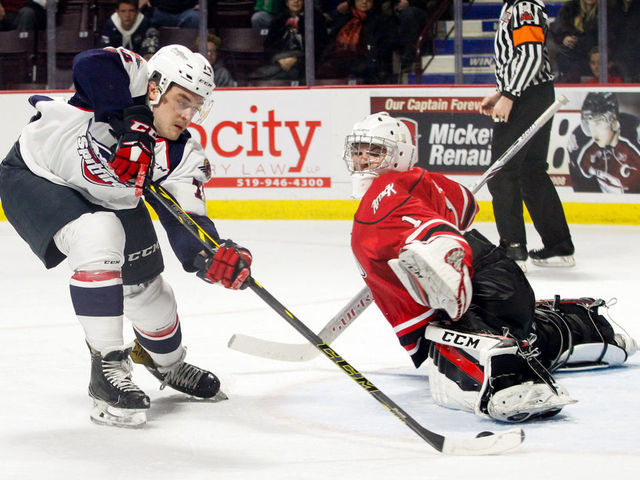 WINDSOR, ON - NOVEMBER 16: Defenceman Sean Day #74 of the Windsor Spitfires scores his second-period goal past goaltender Mack Guzda #1 of the Owen Sound Attack on November 16, 2017 at the WFCU Centre in Windsor, Ontario, Canada.