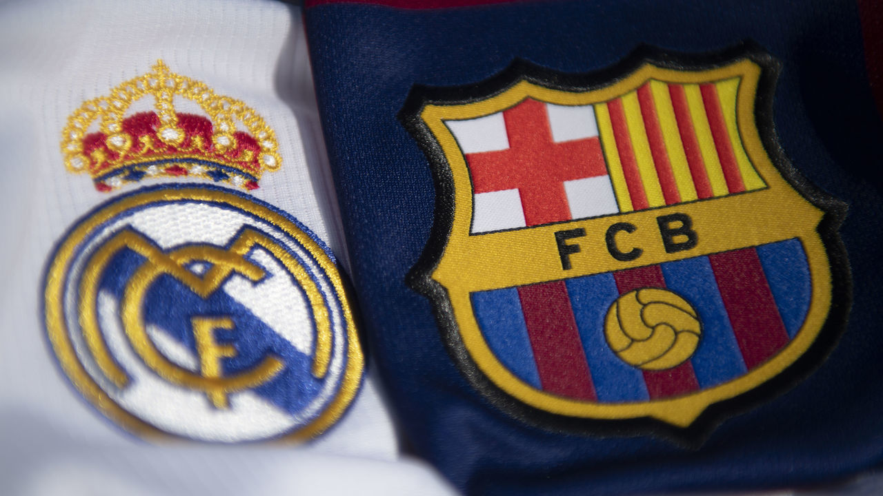 WHICHFORD, ENGLAND - MAY 06: Real Madrid and Barcelona club crests on their respective home shirts for the 2019-20 season on May 6, 2020 in Warwickshire, UK.