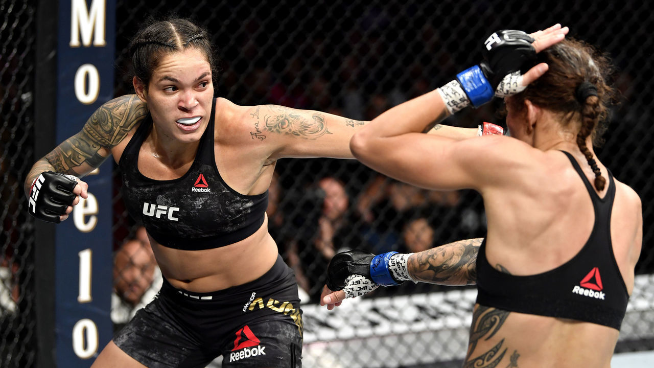 LAS VEGAS, NEVADA - DECEMBER 14: (L-R) Amanda Nunes of Brazil strikes Germaine de Randamie of Netherlands in their UFC women's bantamweight championship bout during the UFC 245 event at T-Mobile Arena on December 14, 2019 in Las Vegas, Nevada.