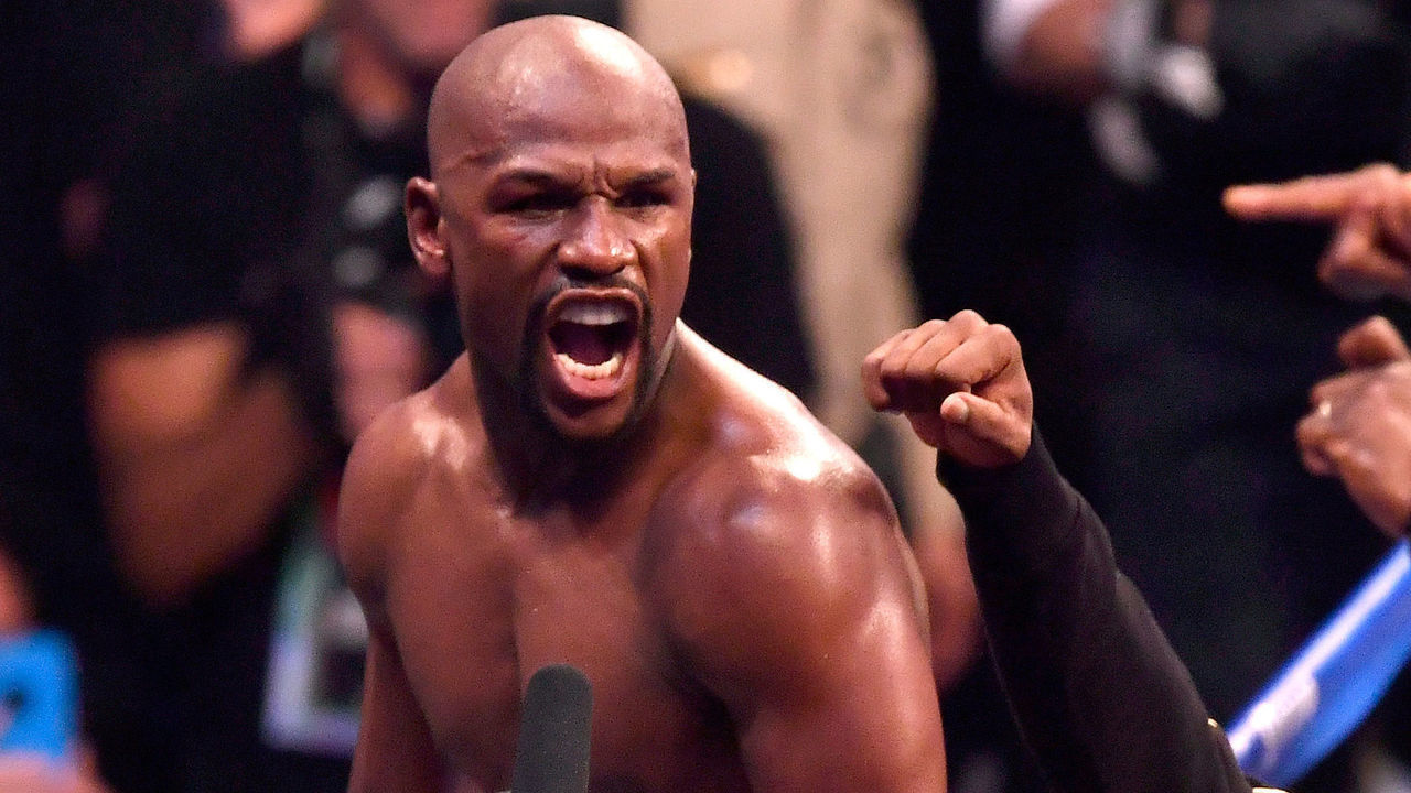 LAS VEGAS, NV - AUGUST 26: Floyd Mayweather Jr. celebrates after his TKO of Conor McGregor in their super welterweight boxing match on August 26, 2017 at T-Mobile Arena in Las Vegas, Nevada.