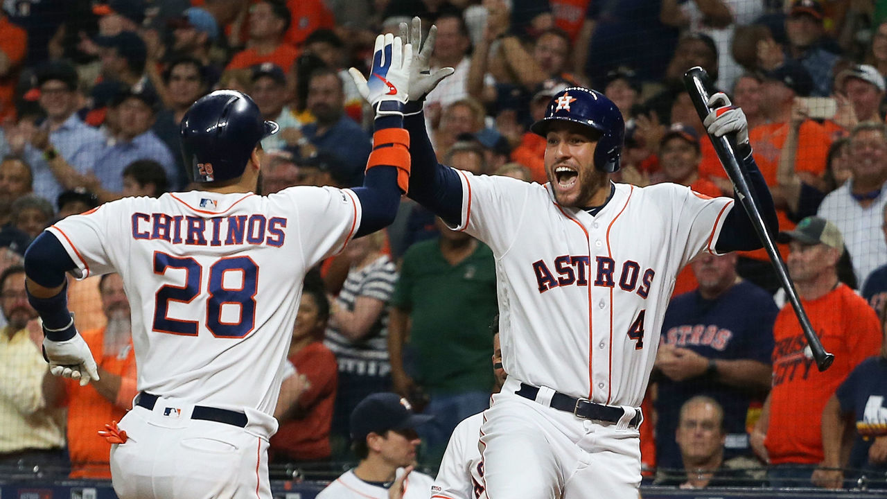 HOUSTON, TEXAS - SEPTEMBER 09: Robinson Chirinos #28 of the Houston Astros receives a high five from George Springer #4 after hitting a home run in the first inning against the Oakland Athletics at Minute Maid Park on September 09, 2019 in Houston, Texas.
