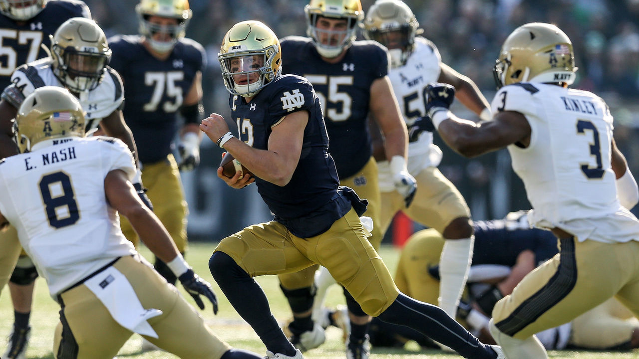 SOUTH BEND, INDIANA - NOVEMBER 16: Ian Book #12 of the Notre Dame Fighting Irish runs with the ball in the first quarter against the Navy Midshipmen at Notre Dame Stadium on November 16, 2019 in South Bend, Indiana.