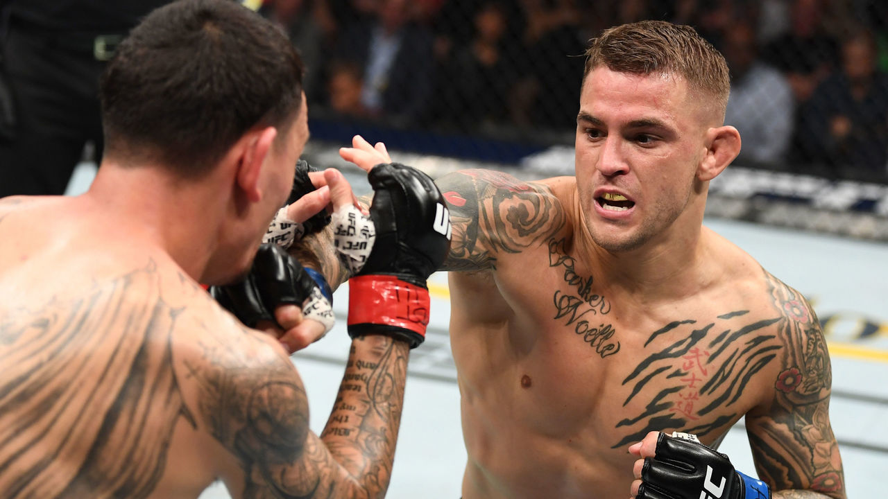 ATLANTA, GA - APRIL 13: (R-L) Dustin Poirier punches Max Holloway in their interim lightweight championship bout during the UFC 236 event at State Farm Arena on April 13, 2019 in Atlanta, Georgia.