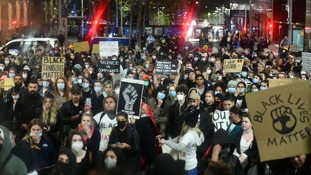 Protesters demonstrate at Martin place during a ''Black Lives Matter'' rally, held in solidarity with U.S. Protests over the death of George Floyd on June 02, 2020 in Sydney, Australia. The event was organised to rally against aboriginal deaths in custody in Australia as well as in solidarity with protests across the United States following the killing of an unarmed black man George Floyd at the hands of a police officer in Minneapolis, Minnesota.