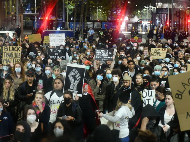 Protesters demonstrate at Martin place during a ''Black Lives Matter'' rally, held in solidarity with U.S. Protests over the death of George Floyd on June 02, 2020 in Sydney, Australia. The event was organised to rally against aboriginal deaths in custody in Australia as well as in solidarity with protests across the United States following the killing of an unarmed black man George Floyd at the hands of a police officer in Minneapolis, Minnesota.