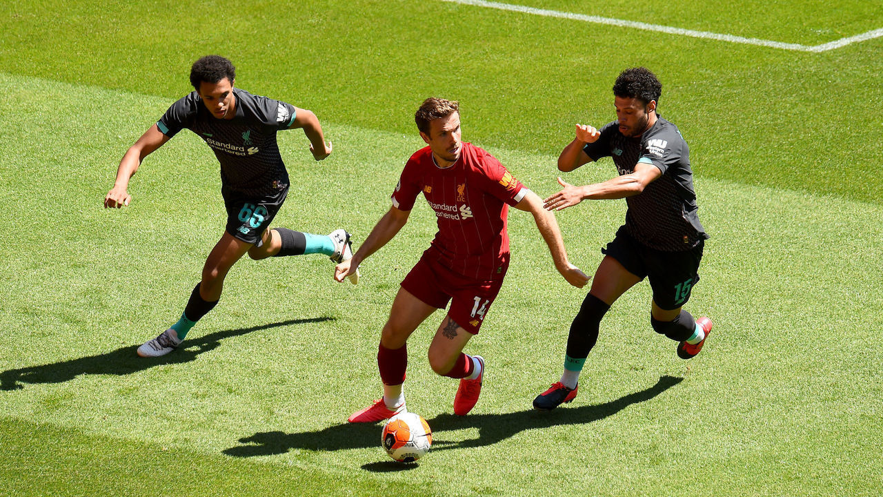 LIVERPOOL, ENGLAND - JUNE 01: (THE SUN OUT, THE SUN ON SUNDAY OUT) Jordan Henderson captain of Liverpool with Trent Alexander-Arnold and Alex Oxlade-Chamberlain of Liverpool during a training session at Anfield on June 01, 2020 in Liverpool, England.