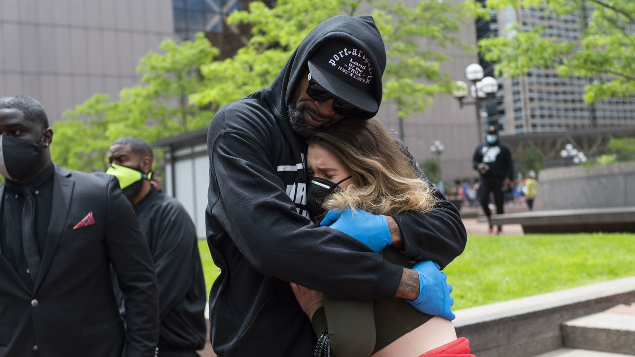 MINNEAPOLIS, MN - MAY 29: Former NBA player Stephen Jackson hugs a woman after speaking at a protest outside the Hennepin County Government Center on May 29, 2020 in Minneapolis, Minnesota. Protests in Minnesota and around the country have been ongoing since George Floyd's death on Monday.