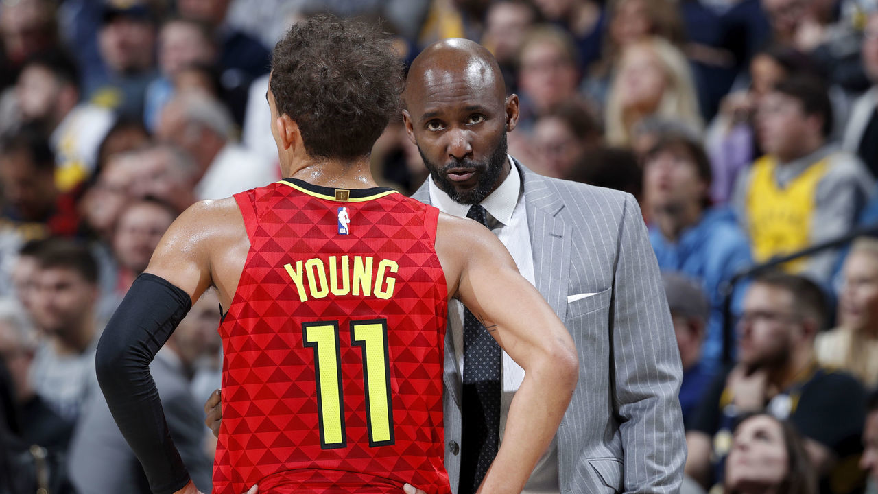 INDIANAPOLIS, IN - NOVEMBER 29: Head coach Lloyd Pierce of the Atlanta Hawks talks to Trae Young #11 during a game against the Indiana Pacers at Bankers Life Fieldhouse on November 29, 2019 in Indianapolis, Indiana. The Pacers defeated the Hawks 105-104 in overtime.