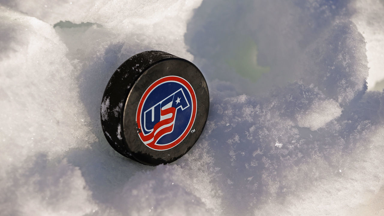 EAGLE RIVER, WI - FEBRUARY 08: A USA Hockey puck rests in the snow during the the 2013 USA Hockey Pond Hockey National Championships on February 8, 2013 in Eagle River, Wisconsin. The three-day tournament features 2,400 participants from 30 states playing a round robin tournament on 28 rinks laid out on Dollar Lake.