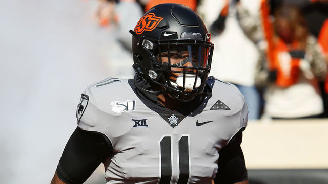 STILLWATER, OK - NOVEMBER 16: Linebacker Amen Ogbongbemiga #11 of the Oklahoma State Cowboys runs onto the field for a game against the Kansas Jayhawks on November 16, 2019 at Boone Pickens Stadium in Stillwater, Oklahoma. OSU won 31-13.