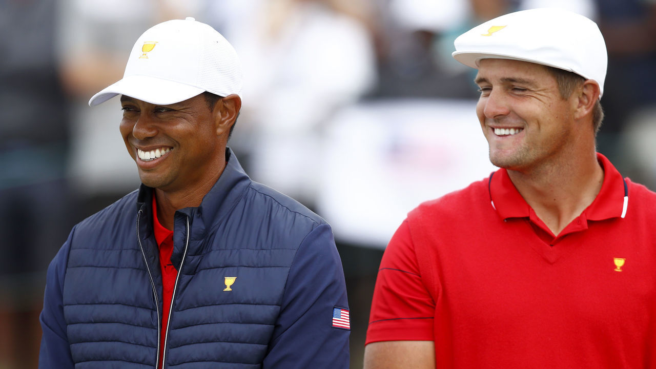 MELBOURNE, AUSTRALIA - DECEMBER 15: Playing Captain Tiger Woods of the United States team and Bryson DeChambeau of the United States team celebrate after they won the Presidents Cup 16-14 during Sunday Singles matches on day four of the 2019 Presidents Cup at Royal Melbourne Golf Course on December 15, 2019 in Melbourne, Australia.