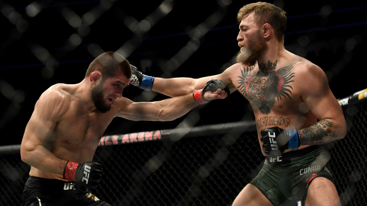 LAS VEGAS, CA - OCTOBER 06: Khabib Nurmagomedov, left, and Conor McGregor exchange punches during their fight at UFC 229 at the T-Mobile Arena in Las Vegas, Nev. Friday, Oct. 6, 2018.
