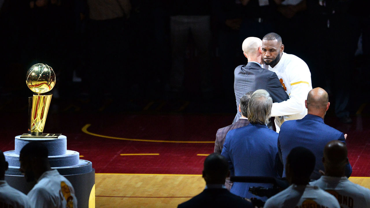 CLEVELAND, OH - OCTOBER 25: LeBron James #23 of the Cleveland Cavaliers receives his championship ring from NBA commissioner Adam Silver before the game against the New York Knicks at Quicken Loans Arena on October 25, 2016 in Cleveland, Ohio.