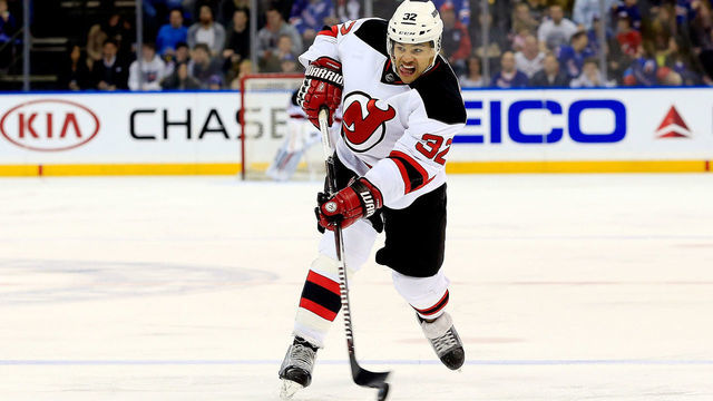 NEW YORK, NY - APRIL 04: Mark Fraser #32 of the New Jersey Devils takes a shot against the New York Rangers during a game at Madison Square Garden on April 4, 2015 in New York City.