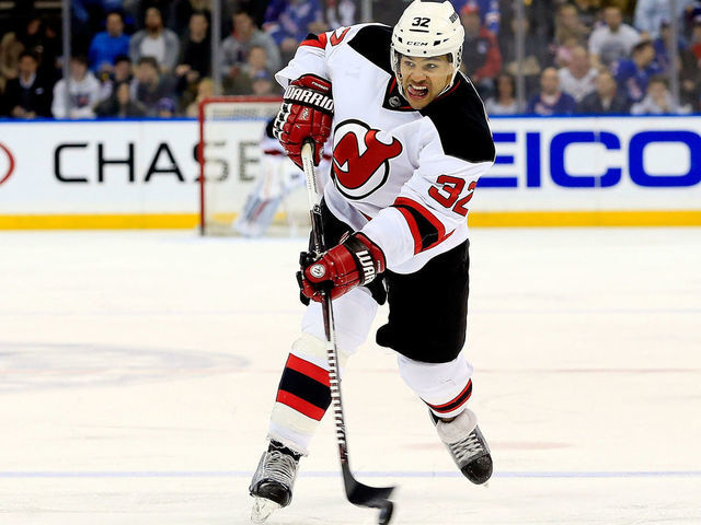 NEW YORK, NY - APRIL 04: Mark Fraser #32 of the New Jersey Devils takes a shot against the New York Rangers during a game at Madison Square Garden on April 4, 2015 in New York City.