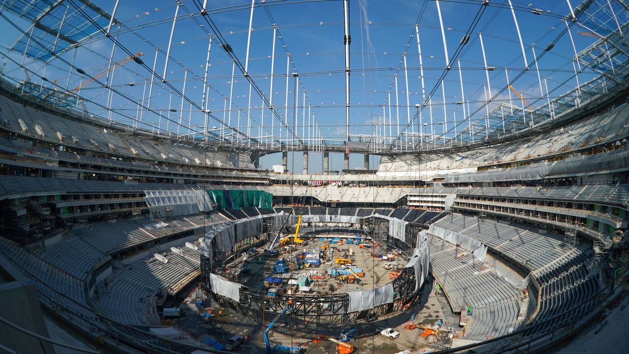 INGLEWOOD, CA - JANUARY 22: The giant Oculus 2-sided video board is being assembled inside on the floor of SoFi Stadium as roofing panels begin to cover the entire structure as it nears completion in Inglewood on Wednesday, Jan. 22, 2020. The stadium will open in the summer.