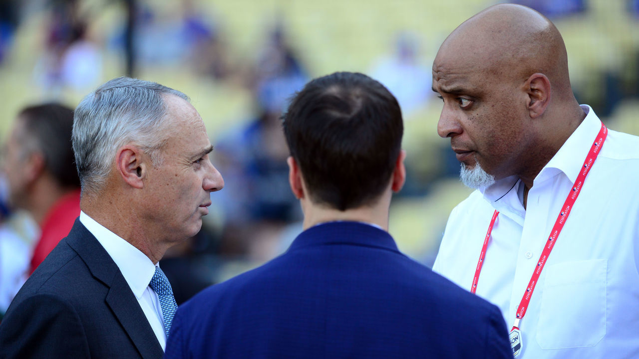 LOS ANGELES, CA - OCTOBER 25: Major League Baseball Commissioner Robert D. Manfred Jr. talks with Executive Director of the Major League Baseball Players Association Tony Clark during batting practice prior to Game 2 of the 2017 World Series between the Houston Astros and the Los Angeles Dodgers at Dodger Stadium on Wednesday, October 25, 2017 in Los Angeles, California.