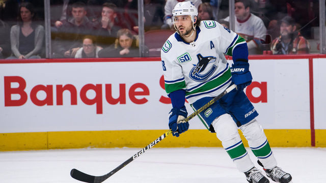 MONTREAL, QC - FEBRUARY 25: Christopher Tanev (8) of the Vancouver Canucks skates during the first period period of the NHL game between the Vancouver Canucks and the Montreal Canadiens on February 25, 2020, at the Bell Centre in Montreal, QC
