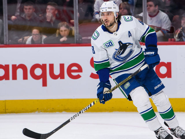 MONTREAL, QC - FEBRUARY 25: Christopher Tanev (8) of the Vancouver Canucks skates during the first period period of the NHL game between the Vancouver Canucks and the Montreal Canadiens on February 25, 2020, at the Bell Centre in Montreal, QC