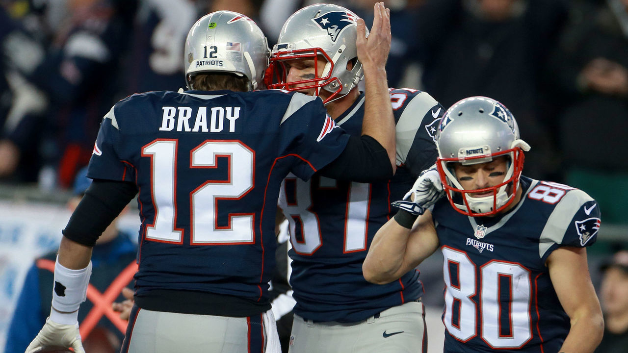FOXBOROUGH, MA - JANUARY 16: Patriots quarterback Tom Brady congratulates tight end Rob Gronkowski after Gronkowski made a touchdown in the first quarter. Julian Edelman is on the right. The New England Patriots hosted the Kansas City Chiefs in an AFC divisional playoff game at Gillette Stadium in Foxborough, Mass., Saturday, Jan. 16, 2016.
