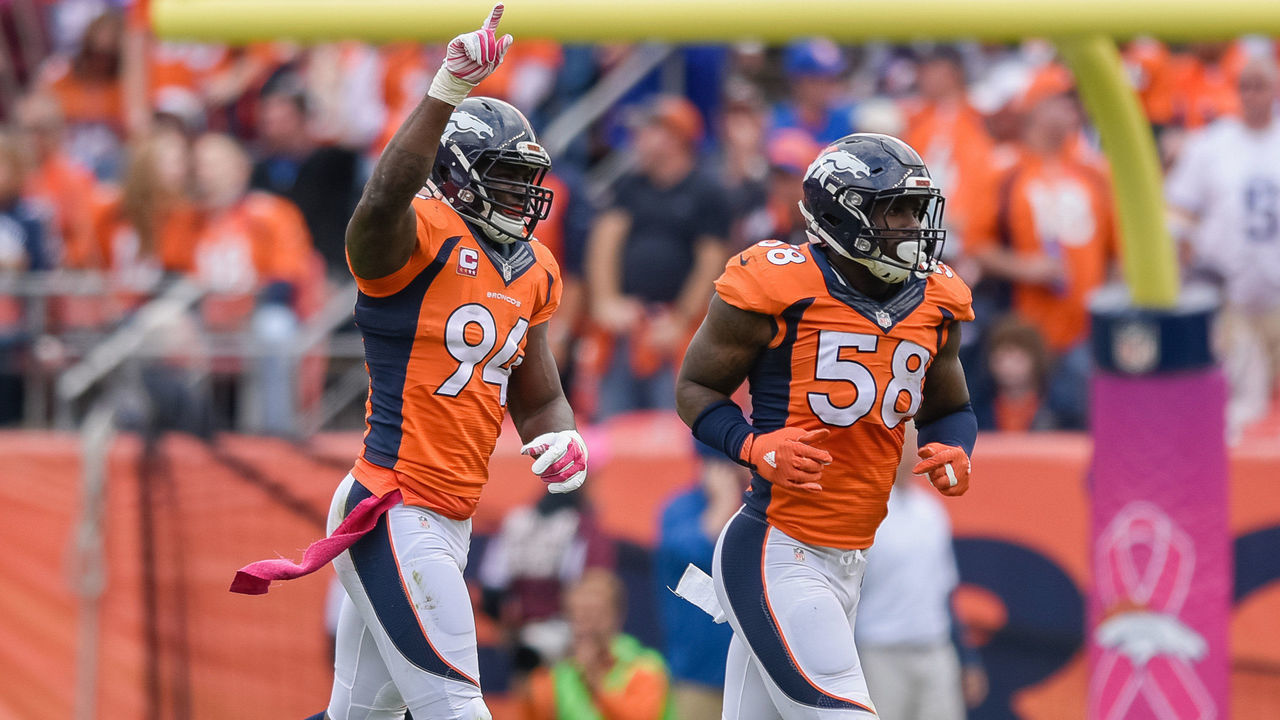 04 October 2015: Denver Broncos Linebacker DeMarcus Ware (94) [7910] celebrates with Denver Broncos Linebacker Von Miller (58) [16558], and teammates after making a tackle in action during a game between the Minnesota Vikings and the Denver Broncos at Sports Authority Field at Mile High in Denver, CO.