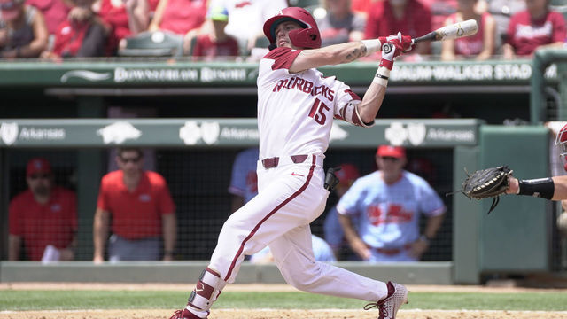FAYETTEVILLE, AR - JUNE 08: Arkansas Razorbacks infielder Casey Martin (15) at bat during the NCAA Super Regional baseball game between the Arkansas Razorbacks and Ole Miss Rebels on June 8, 2019 at Baum Stadium in Fayetteville, AR.