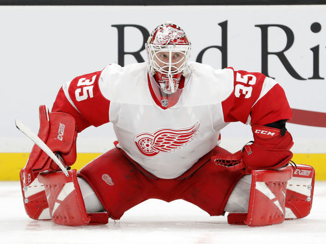 BOSTON, MA - FEBRUARY 15: Detroit Red Wings goalie Jimmy Howard (35) stretches in warm up before a game between the Boston Bruins and the Detroit Red Wings on February 15, 2020, at TD Garden in Boston, Massachusetts.