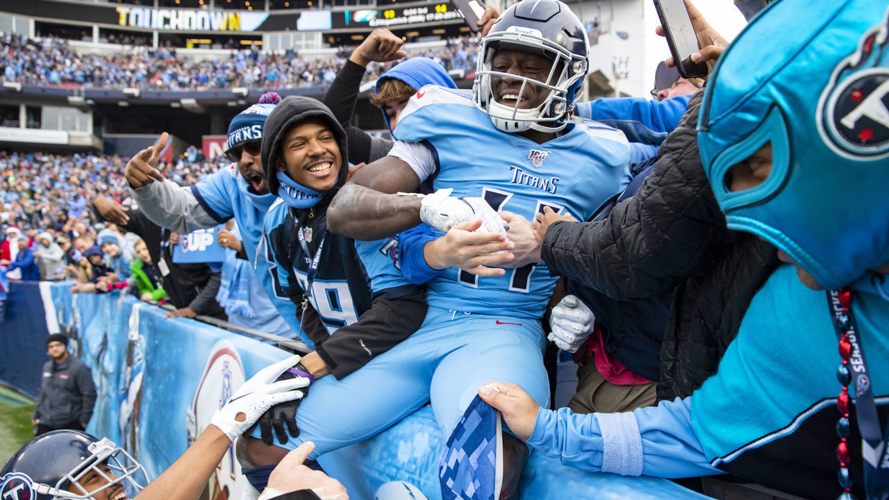 NASHVILLE, TN - DECEMBER 15: A.J. Brown #11 of the Tennessee Titans celebrates a touchdown reception by jumping into the crowd during the fourth quarter against the Houston Texans at Nissan Stadium on December 15, 2019 in Nashville, Tennessee. Houston defeats Tennessee 24-21.