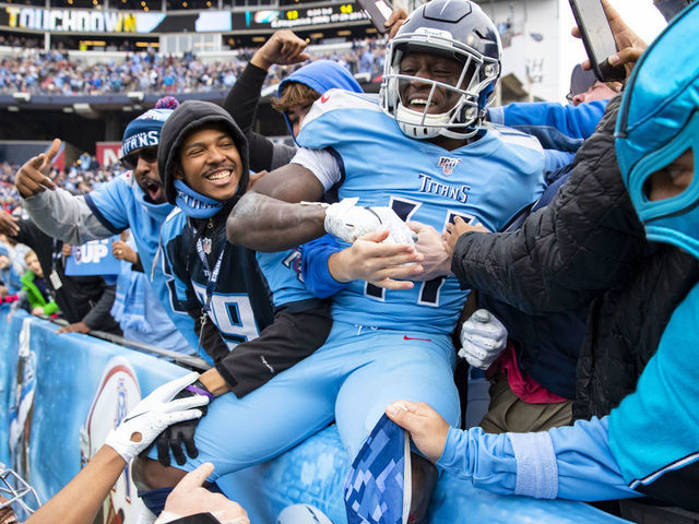 NASHVILLE, TN - DECEMBER 15: A.J. Brown #11 of the Tennessee Titans celebrates a touchdown reception by jumping into the crowd during the fourth quarter against the Houston Texans at Nissan Stadium on December 15, 2019 in Nashville, Tennessee. Houston defeats Tennessee 24-21.