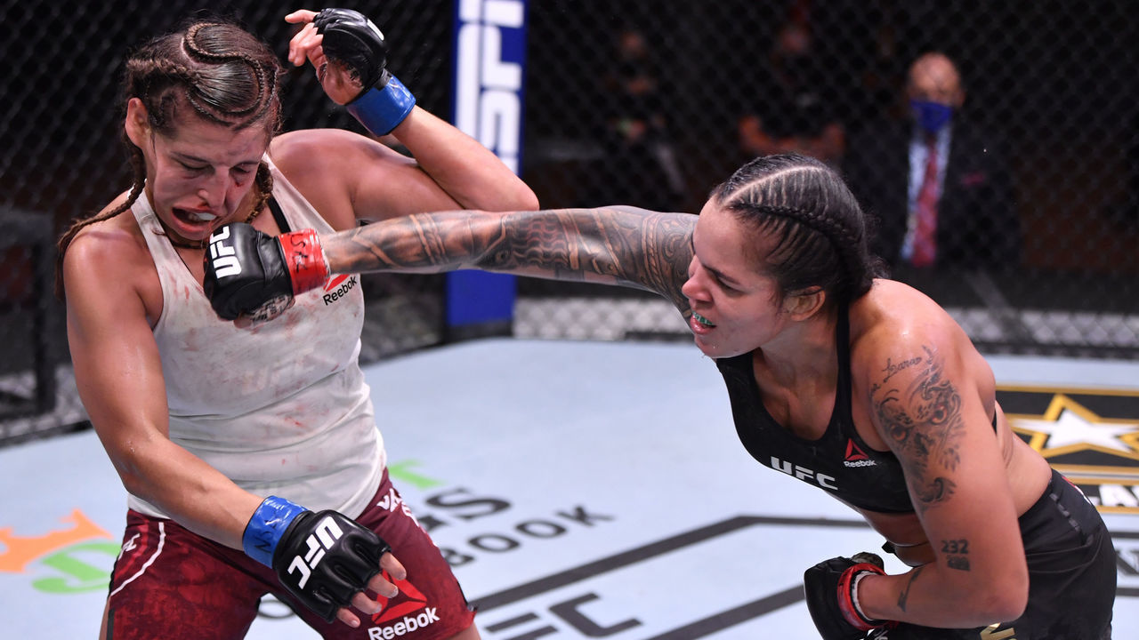 LAS VEGAS, NEVADA - JUNE 06: (R-L) Amanda Nunes of Brazil punches Felicia Spencer of Canada in their UFC featherweight championship bout during the UFC 250 event at UFC APEX on June 06, 2020 in Las Vegas, Nevada.