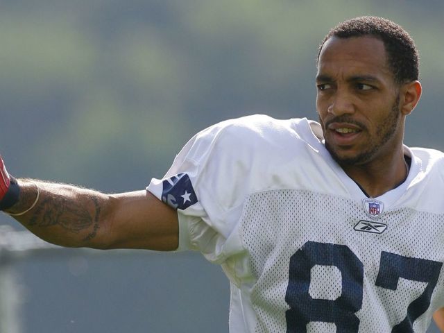 FOXBORO, MA - JULY 27: Wide receiver Reche Caldwell #87 of the New England Patriots reacts to fans during training camp practice on July 27, 2007 at Gillette Stadium in Foxboro, Massachusetts.