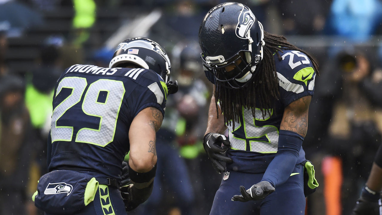 SEATTLE, WA - DECEMBER 27: Free safety Earl Thomas #29 and cornerback Richard Sherman #25 of the Seattle Seahawks play a little air guitar before the game against the St. Louis Rams at CenturyLink Field on December 27, 2015 in Seattle,Washington.