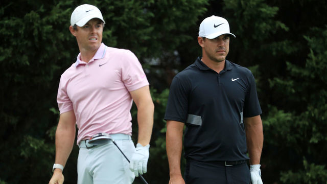 ATLANTA, GEORGIA - AUGUST 25: Brooks Koepka of the United States and Rory McIlroy of Northern Ireland look on from the eighth tee during the final round of the TOUR Championship at East Lake Golf Club on August 25, 2019 in Atlanta, Georgia.