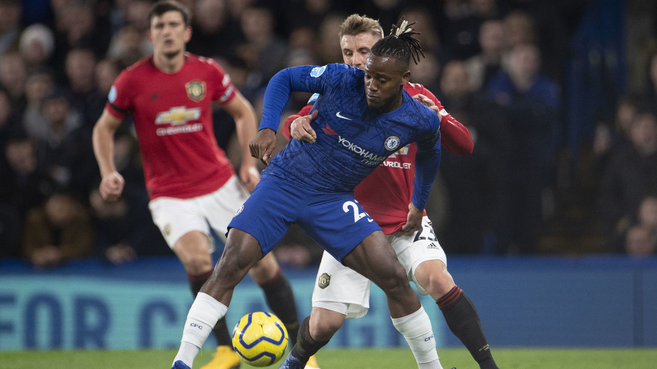 LONDON, ENGLAND - FEBRUARY 17: Luke Shaw of Manchester United and Michy Batshuayi of Chelsea during the Premier League match between Chelsea FC and Manchester United at Stamford Bridge on February 17, 2020 in London, United Kingdom.