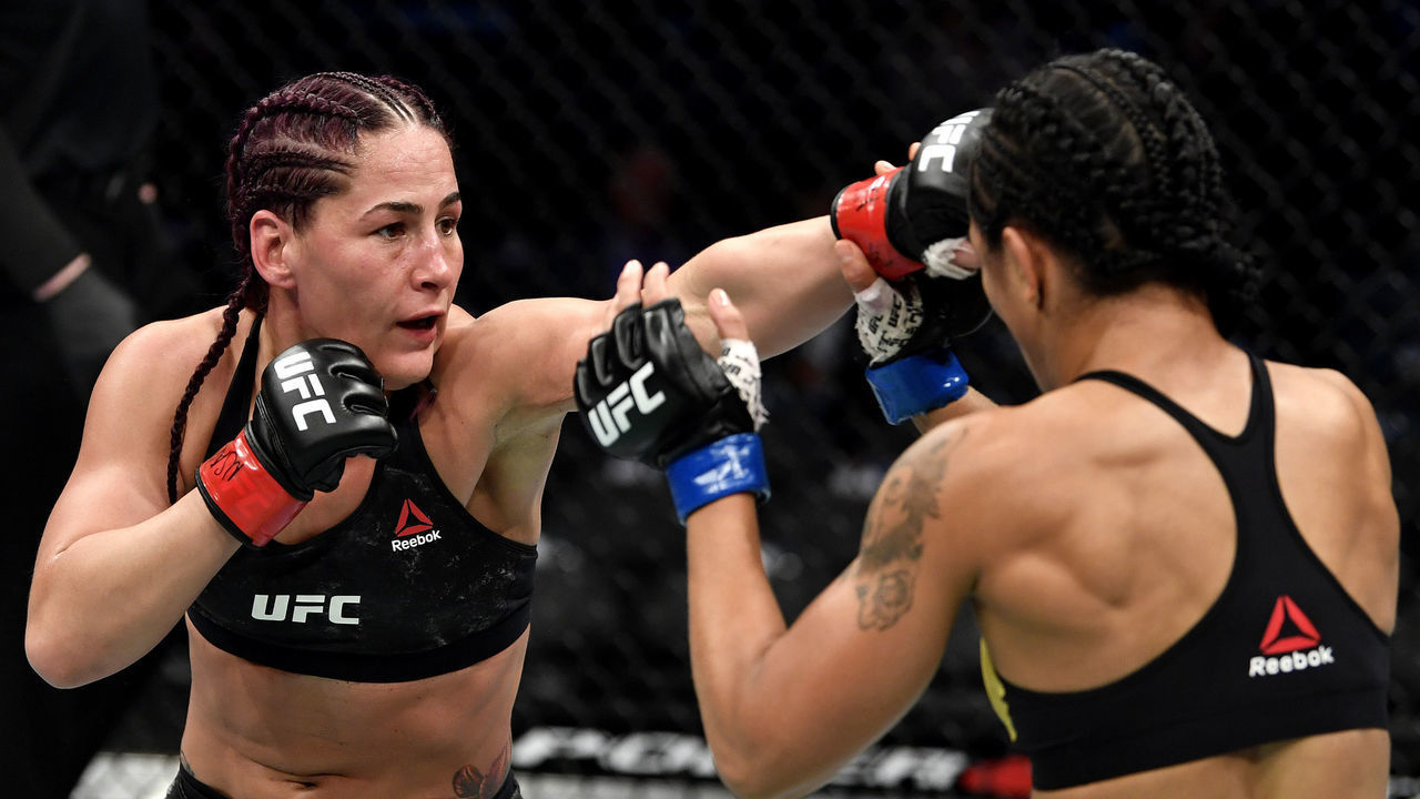 LAS VEGAS, NEVADA - DECEMBER 14: (L-R) Jessica Eye strikes Viviane Araujo of Brazil in their women's flyweight bout during the UFC 245 event at T-Mobile Arena on December 14, 2019 in Las Vegas, Nevada.