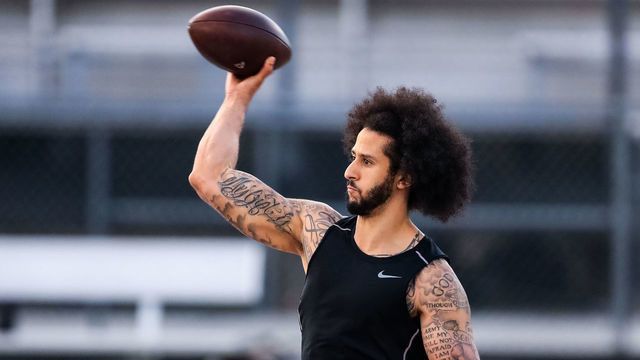 RIVERDALE, GA - NOVEMBER 16: Colin Kaepernick looks to pass during his NFL workout held at Charles R Drew high school on November 16, 2019 in Riverdale, Georgia.