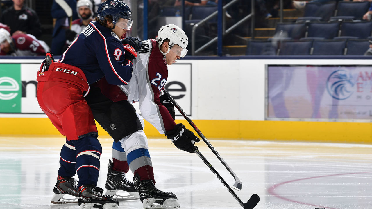COLUMBUS, OH - OCTOBER 9: Nathan McKinnon #29 of the Colorado Avalanche shields the puck from Artemi Panarin #9 of the Columbus Blue Jackets during the third period of a game on October 9, 2018 at Nationwide Arena in Columbus, Ohio.