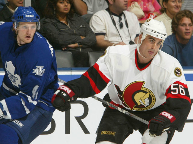 TORONTO - SEPTEMBER 18: Brandon Bochenski #56 of the Ottawa Senators skates alongside with Staffan Kronwall #44 of the Toronto Maple Leafs during the NHL preseason game at the Air Canada Centre September 18, 2005 in Toronto, Ontario. The Senators won the game 5-2.