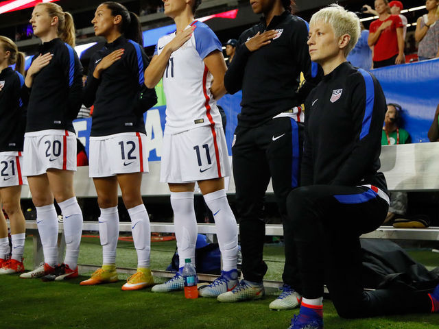 ATLANTA, GA - SEPTEMBER 18: Megan Rapinoe #15 kneels during the National Anthem prior to the match between the United States and the Netherlands at Georgia Dome on September 18, 2016 in Atlanta, Georgia.