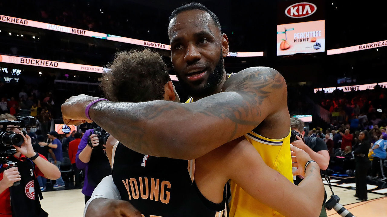 ATLANTA, GEORGIA - DECEMBER 15: LeBron James #23 of the Los Angeles Lakers hugs Trae Young #11 of the Atlanta Hawks at State Farm Arena on December 15, 2019 in Atlanta, Georgia. NOTE TO USER: User expressly acknowledges and agrees that, by downloading and/or using this photograph, user is consenting to the terms and conditions of the Getty Images License Agreement.